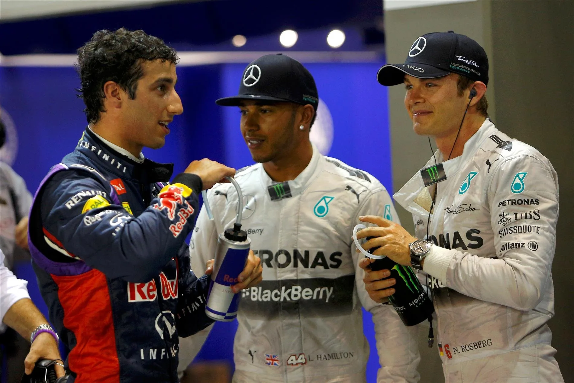 (L to R): Daniel Ricciardo (AUS) Red Bull Racing, pole sitter Lewis Hamilton (GBR) Mercedes AMG F1 and Nico Rosberg (GER) Mercedes AMG F1 celebrate in parc ferme. Formula One World Championship, Rd14, Singapore Grand Prix, Marina Bay Street Circuit, Singapore, Qualifying, Saturday, 20 September 2014 © Sutton Images. No reproduction without permission