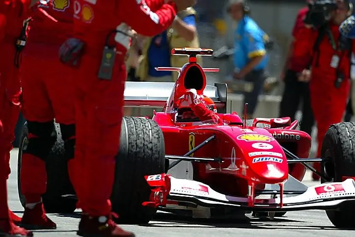 Race winner Michael Schumacher (GER) Ferrari F2004 salutes the Ferrari mechanics in parc ferme. Formula One World Championship, Rd9, United States Grand Prix, Race Day, Indianapolis, USA, 20 June 2004. © Sutton Images