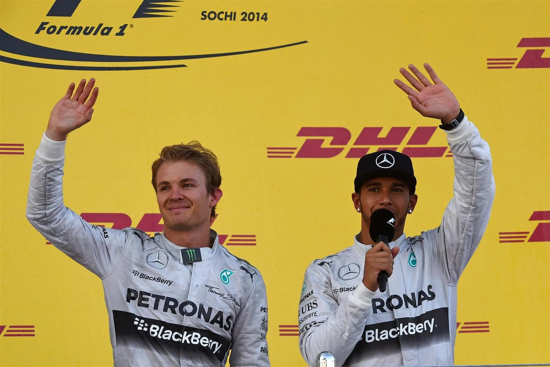 (L to R): Second placed Nico Rosberg (GER) Mercedes AMG F1 and winner Lewis Hamilton (GBR) Mercedes AMG F1 on the podium. Formula One World Championship, Rd16, Russian Grand Prix, Race, Sochi Autodrom, Sochi, Krasnodar Krai, Russia, Sunday, 12 October 2014