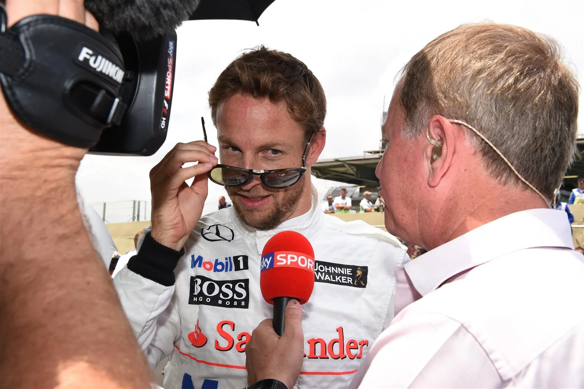 Jenson Button (GBR) McLaren and Martin Brundle (GBR) Sky TV on the grid. Formula One World Championship, Rd18, Brazilian Grand Prix, Race, Sao Paulo, Brazil, Sunday, 9 November 2014