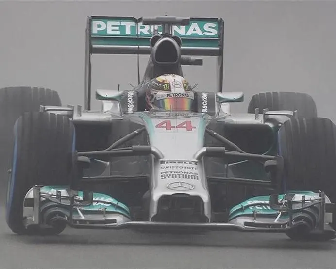 Lewis Hamilton goes fastest in his Mercedes on the blue-walled wet tyres after his first run in Q3. © FOWC Ltd