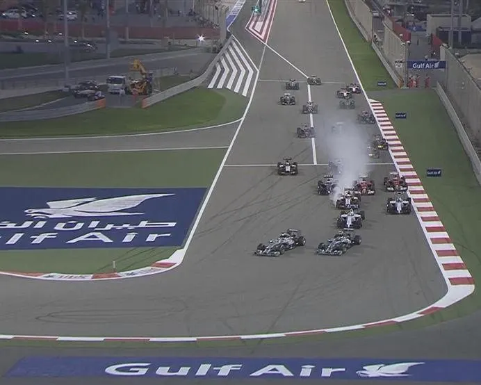 The mad dash down to the first corner. Lewis Hamilton gets a better launch off the line than pole-sitting Mercedes team mate Nico Rosberg and takes the lead. © FOWC Ltd