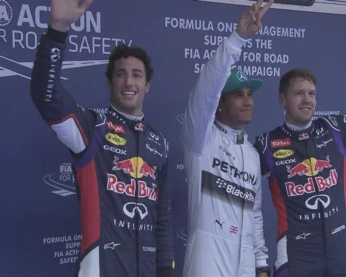 The top three drivers (L to R), Red Bull's Daniel Ricciardo, Mercedes pole man Lewis Hamilton and Red Bull's Sebastian Vettel acknowledge the fans after a thrilling qualifying session in Shanghai. © FOWC Ltd