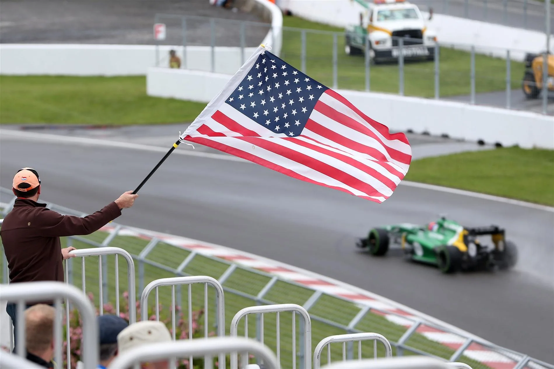 A fan waves the Stars and Stripes for Alexander Rossi (USA) Caterham third driver. Formula One World Championship, Rd7, Canadian Grand Prix, Practice, Montreal, Canada, Friday, 7 June 2013. © Sutton Images