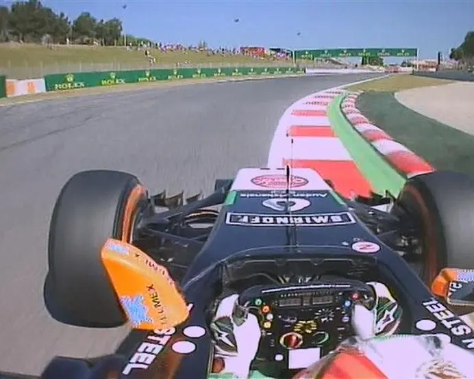 A bizarre early incident for Sergio Perez, as the wing mirror of his Force India falls off during the early part of free practice. © FOWC Ltd