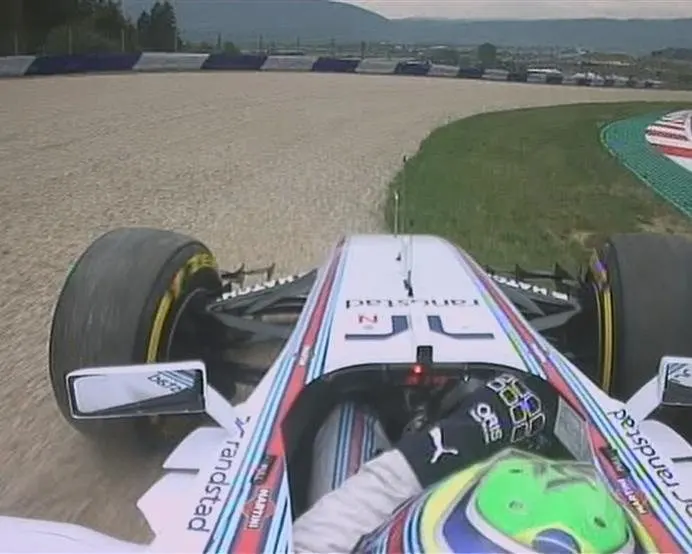 Williams' Felipe Massa locks up his brakes at Turn 3 and runs into the gravel trap, but is able to return and continue. © FOWC Ltd