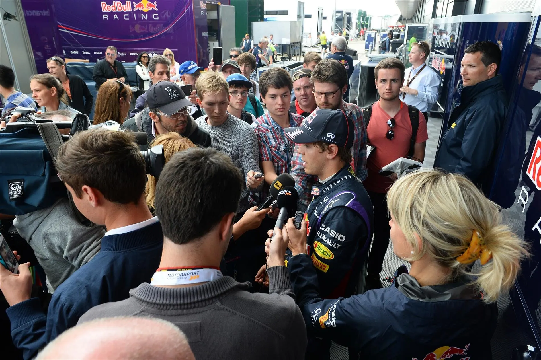 Sebastian Vettel (GER) Red Bull Racing RB10 talks with the media. Formula One Testing, Silverstone, England, Day Two, Wednesday, 9 July 2014