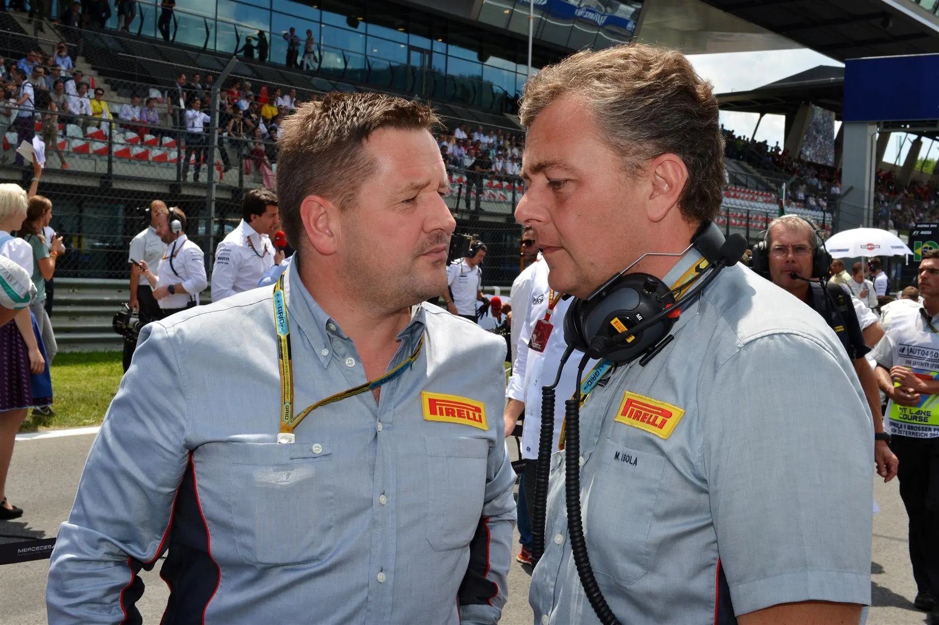 (L to R): Paul Hembery (GBR) Pirelli Motorsport Director and Mario Isola (ITA) Pirelli Sporting Director. Formula One World Championship, Rd8, Austrian Grand Prix, Race, Spielberg, Austria, Sunday, 22 June 2014