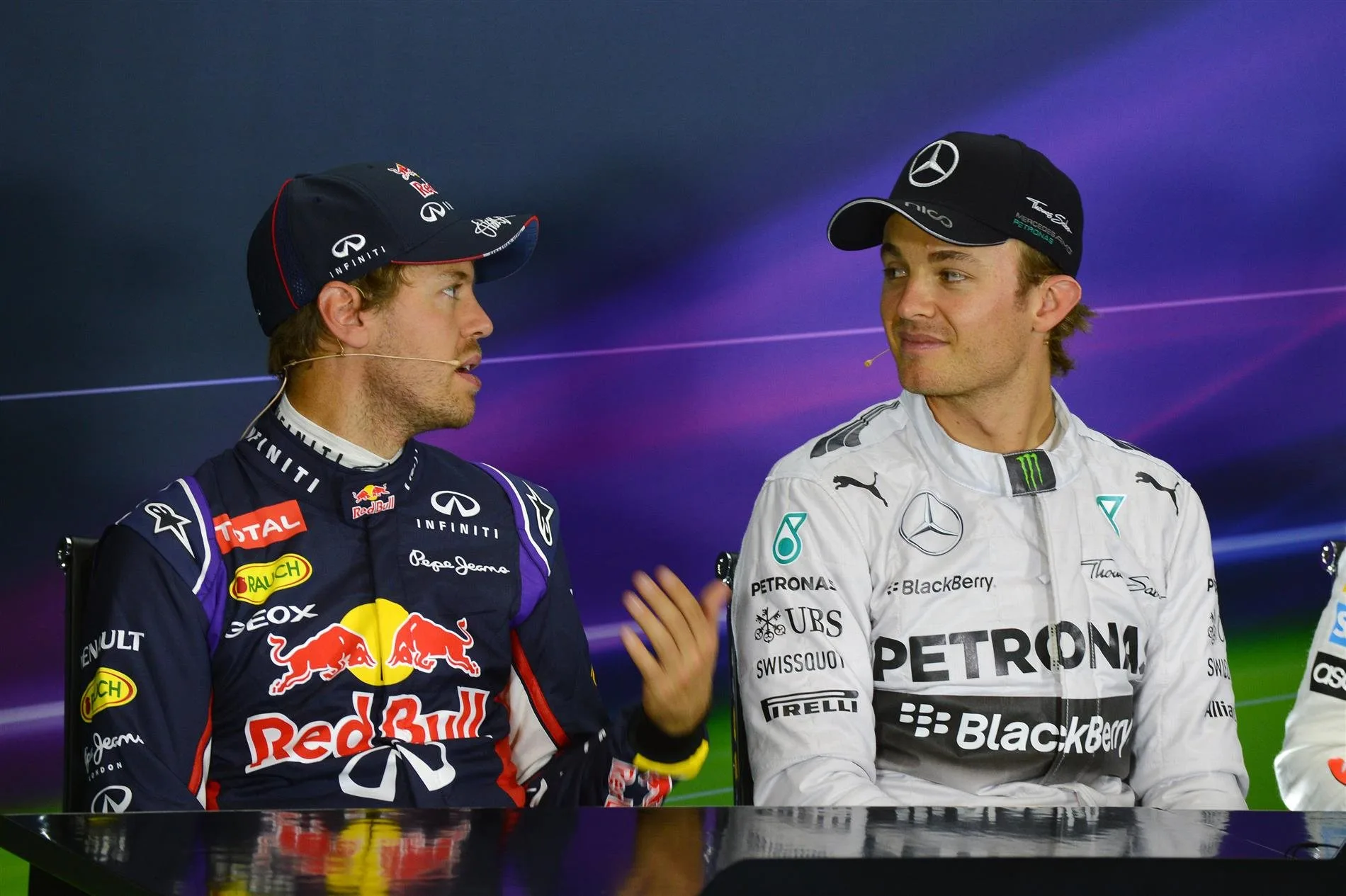 Sebastian Vettel (GER) Red Bull Racing and Nico Rosberg (GER) Mercedes AMG F1 in the Press Conference. Formula One World Championship, Rd9, British Grand Prix, Qualifying, Silverstone, England, Saturday, 5 July 2014