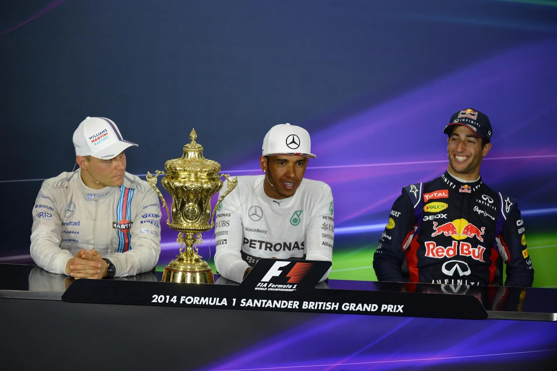 (L to R): Valtteri Bottas (FIN) Williams, race winner Lewis Hamilton (GBR) Mercedes AMG F1 and Daniel Ricciardo (AUS) Red Bull Racing in the Press Conference with the trophy. Formula One World Championship, Rd9, British Grand Prix, Race Day, Silverstone, England, Sunday, 6 July 2014