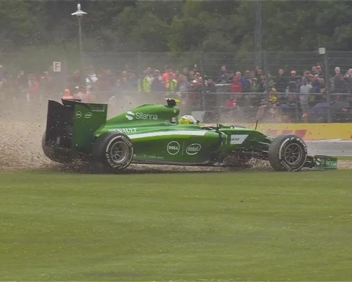 As the track starts to dry many teams switch to slick tyres. The change doesn't work for Caterham's Marcus Ericsson who spins at Becketts. © FOWC Ltd