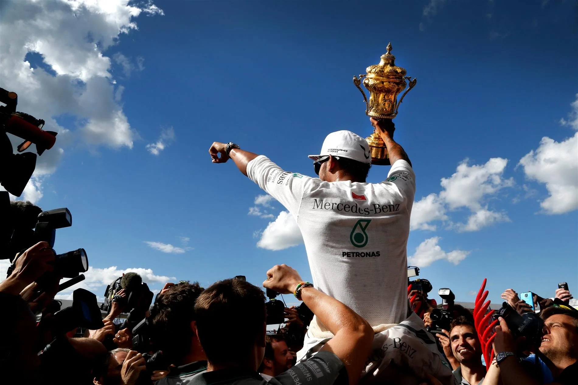 Race winner Lewis Hamilton (GBR) Mercedes AMG F1 celebrates with the trophy. Formula One World Championship, Rd9, British Grand Prix, Race Day, Silverstone, England, Sunday, 6 July 2014