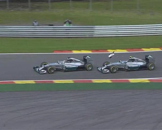 Mercedes' Lewis Hamilton and Nico Rosberg collide at Les Combes while fighting for the lead. Rosberg (right) loses his front wing endplate, while Hamilton suffers a puncture and has to limp back to the pits, dropping to 19th. © FOWC Ltd.