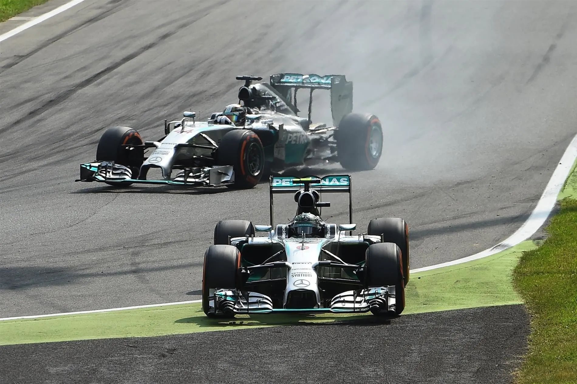 Nico Rosberg (GER) Mercedes AMG F1 W05 goes straight on at the first chicane and Lewis Hamilton (GBR) Mercedes AMG F1 W05 takes the lead. Formula One World Championship, Rd13, Italian Grand Prix, Monza, Italy, Race Day, Sunday, 7 September 2014