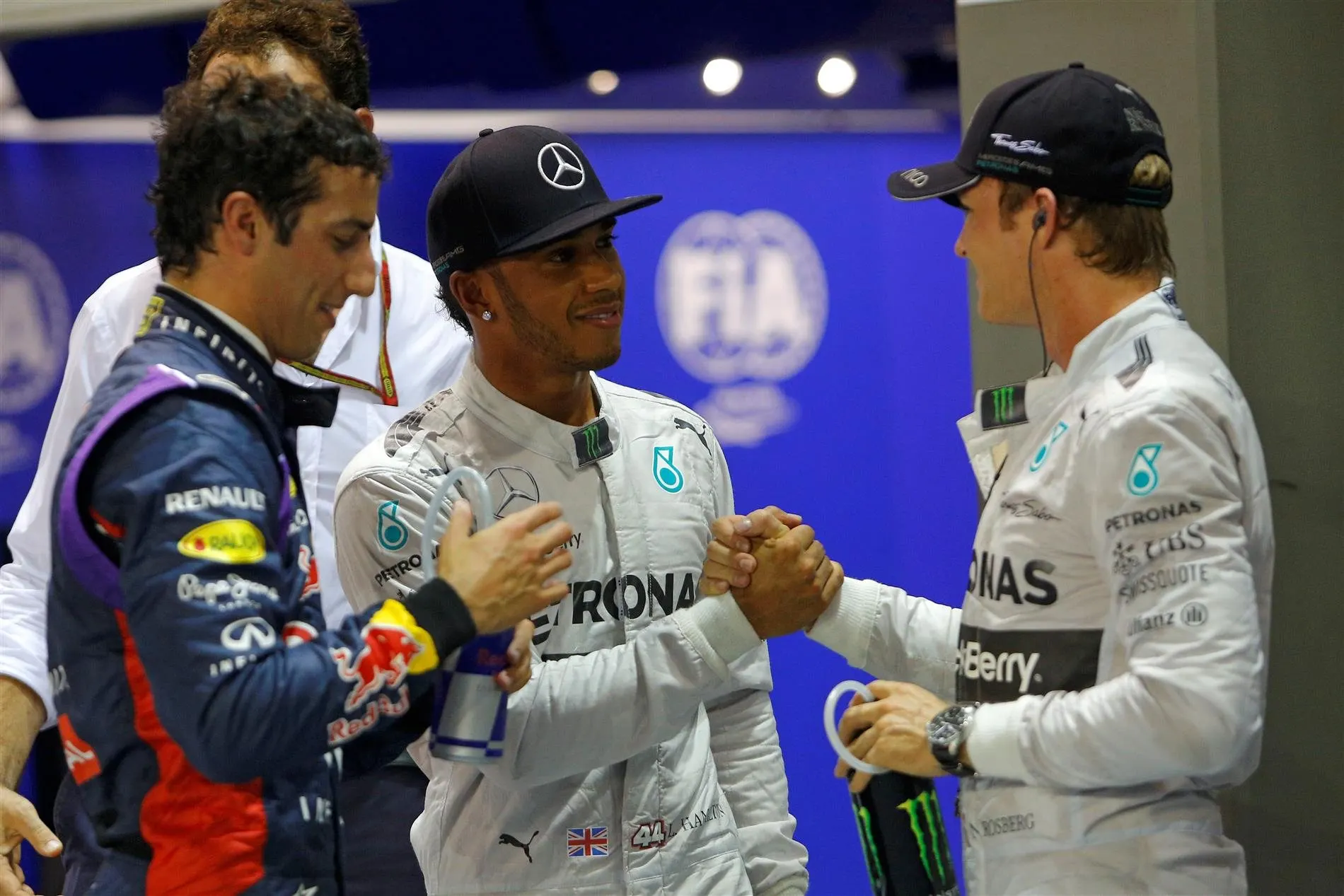(L to R): Daniel Ricciardo (AUS) Red Bull Racing, pole sitter Lewis Hamilton (GBR) Mercedes AMG F1 and Nico Rosberg (GER) Mercedes AMG F1 celebrate in parc ferme. Formula One World Championship, Rd14, Singapore Grand Prix, Marina Bay Street Circuit, Singapore, Qualifying, Saturday, 20 September 2014 