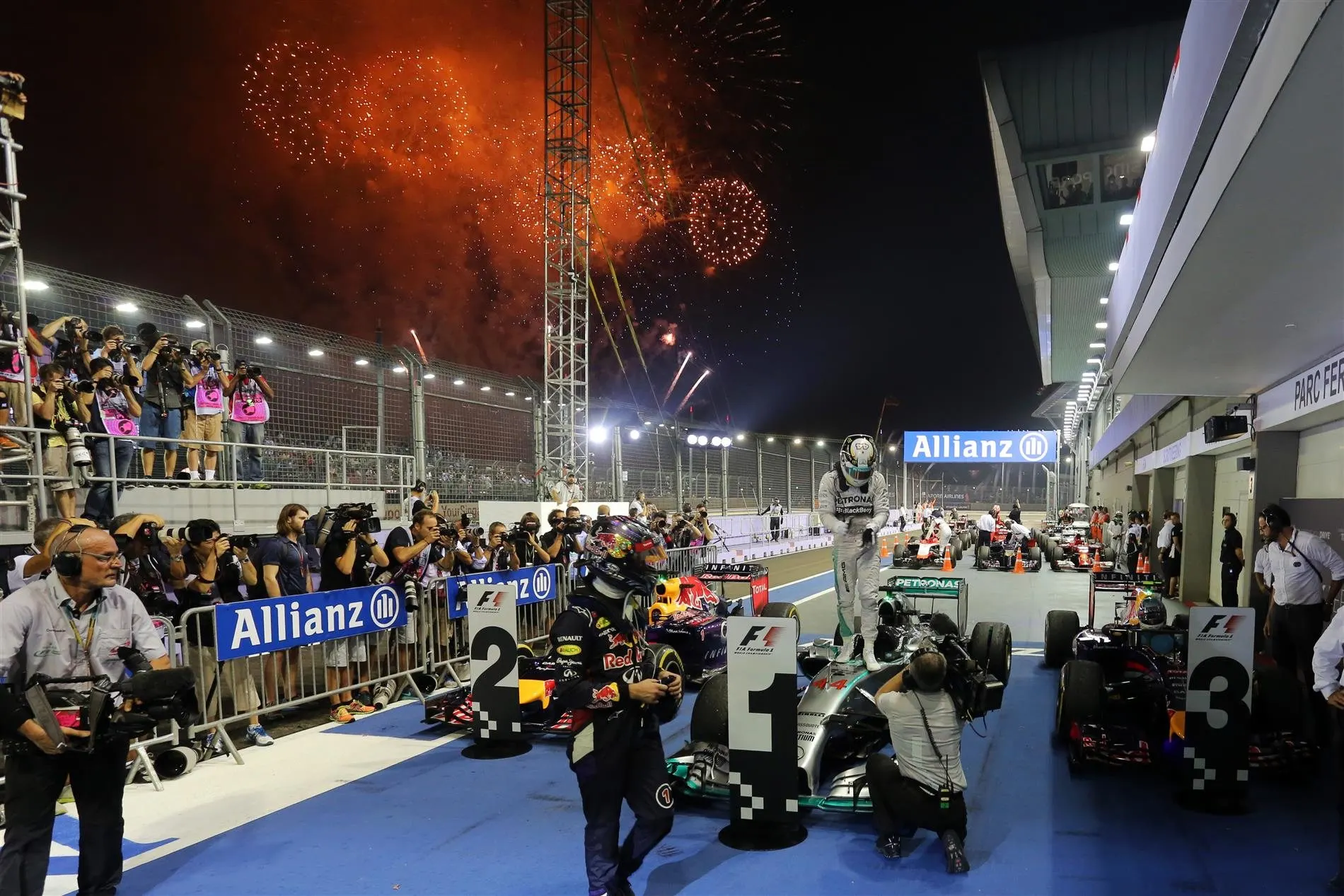Sebastian Vettel (GER) Red Bull Racing and Lewis Hamilton (GBR) Mercedes AMG F1 W05 in parc ferme. Formula One World Championship, Rd14, Singapore Grand Prix, Marina Bay Street Circuit, Singapore, Race Day, Sunday, 21 September 2014