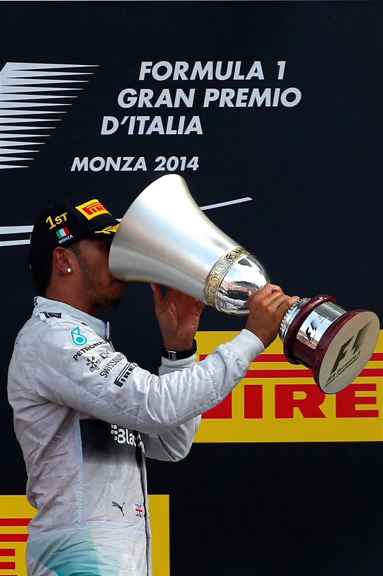 Race winner Lewis Hamilton (GBR) Mercedes AMG F1 with his trophy on the podium. Formula One World Championship, Rd13, Italian Grand Prix, Monza, Italy, Race Day, Sunday, 7 September 2014