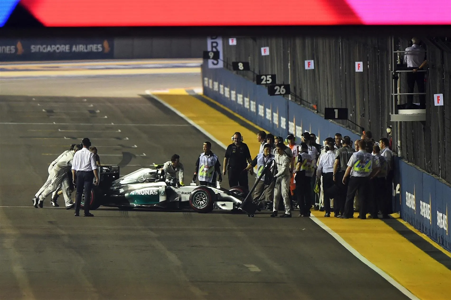 Nico Rosberg (GER) Mercedes AMG F1 W05 stalled on the grid. Formula One World Championship, Rd14, Singapore Grand Prix, Marina Bay Street Circuit, Singapore, Race Day, Sunday, 21 September 2014
