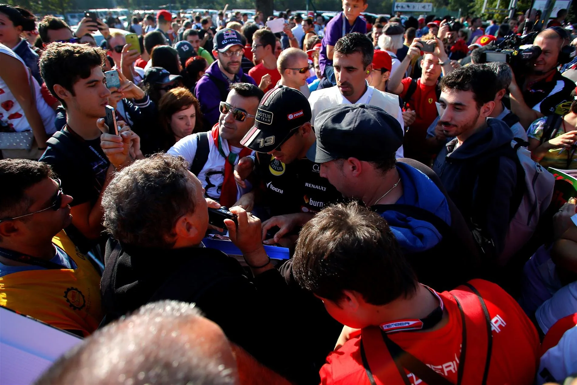Pastor Maldonado (VEN) Lotus arrives at the track and signs autographs for the fans. Formula One World Championship, Rd13, Italian Grand Prix, Monza, Italy, Qualifying, Saturday, 6 September 2014