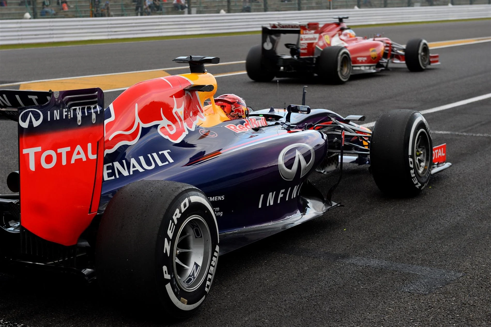 (L to R): Sebastian Vettel (GER) Red Bull Racing RB10 and Fernando Alonso (ESP) Ferrari F14 T. Formula One World Championship, Rd15, Japanese Grand Prix, Practice, Suzuka, Japan, Friday, 3 October 2014
