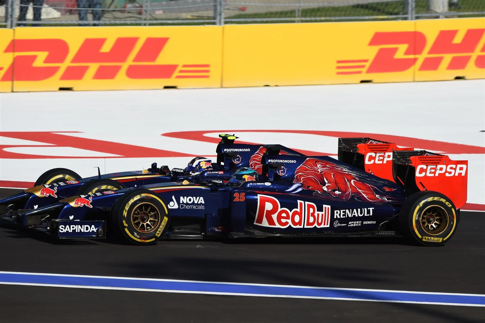 (L to R): Daniil Kvyat (RUS) Scuderia Toro Rosso STR9 battles with Jean-Eric Vergne (FRA) Scuderia Toro Rosso STR9. Formula One World Championship, Rd16, Russian Grand Prix, Race, Sochi Autodrom, Sochi, Krasnodar Krai, Russia, Sunday, 12 October 2014