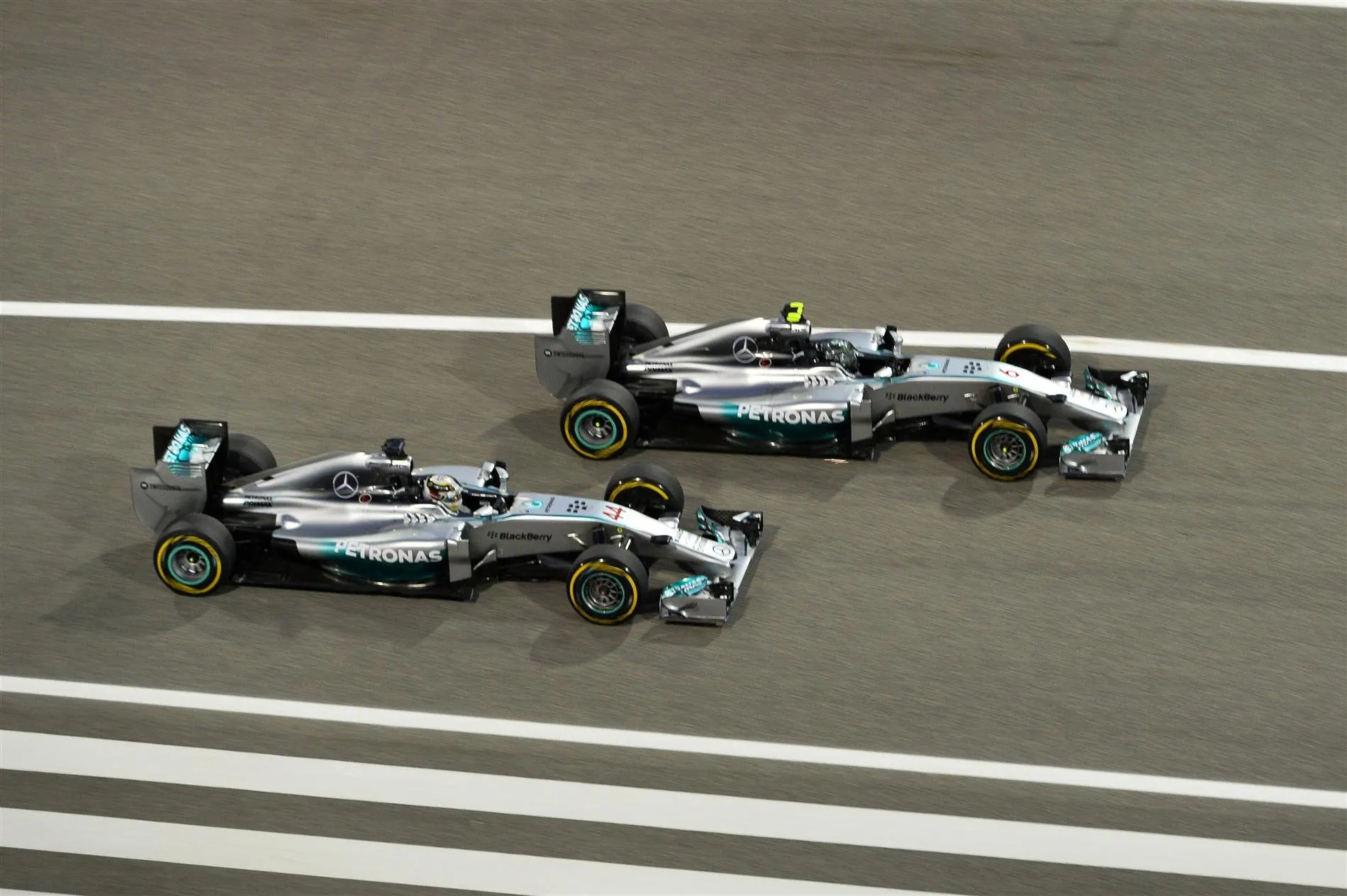 Lewis Hamilton (GBR) Mercedes AMG F1 W05 and Nico Rosberg (GER) Mercedes AMG F1 W05 battle. Formula One World Championship, Rd3, Bahrain Grand Prix, Race, Bahrain International Circuit, Sakhir, Bahrain, Sunday, 6 April 2014