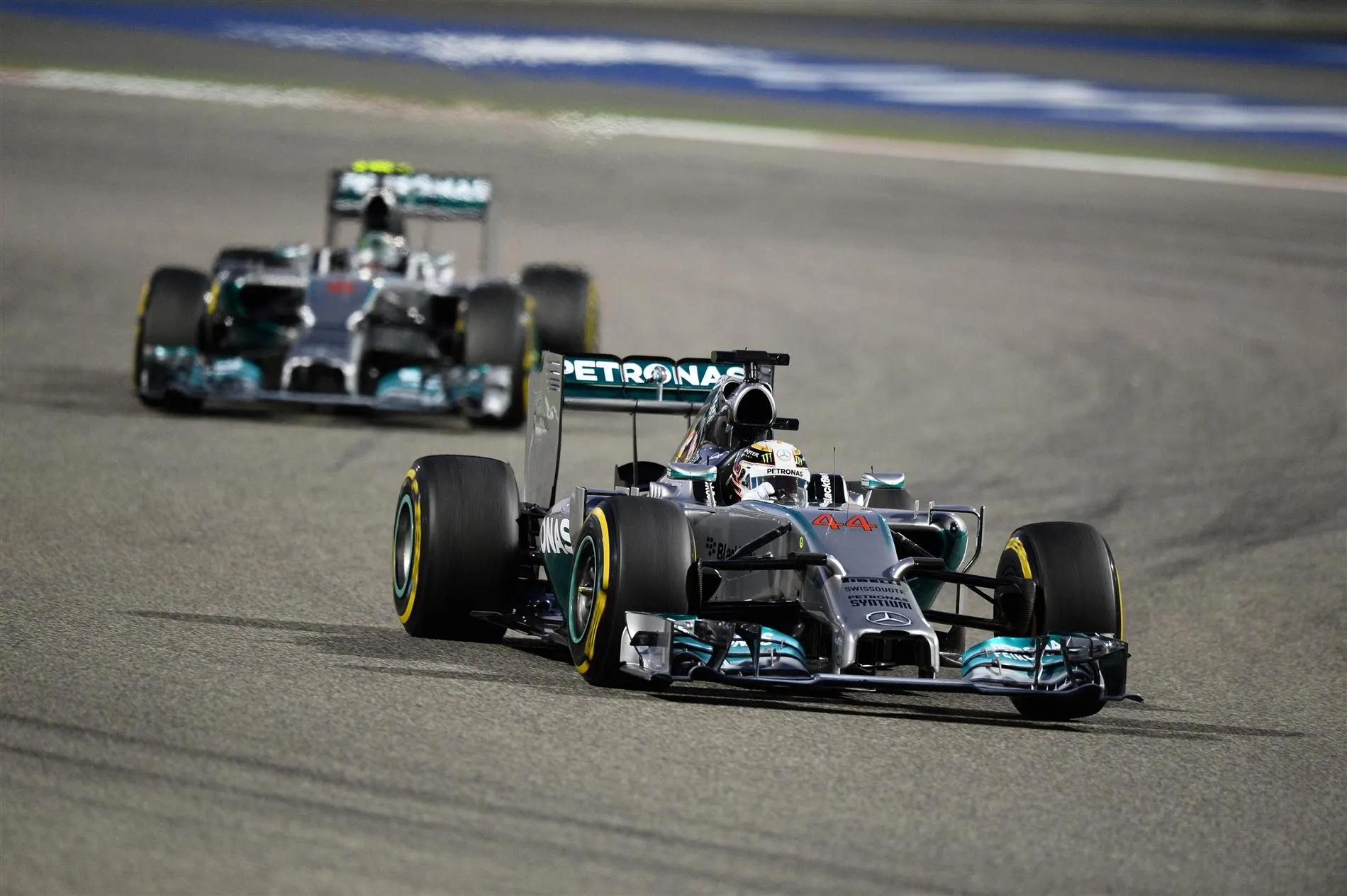Lewis Hamilton (GBR) Mercedes AMG F1 W05 leads Nico Rosberg (GER) Mercedes AMG F1 W05. Formula One World Championship, Rd3, Bahrain Grand Prix, Race, Bahrain International Circuit, Sakhir, Bahrain, Sunday, 6 April 2014