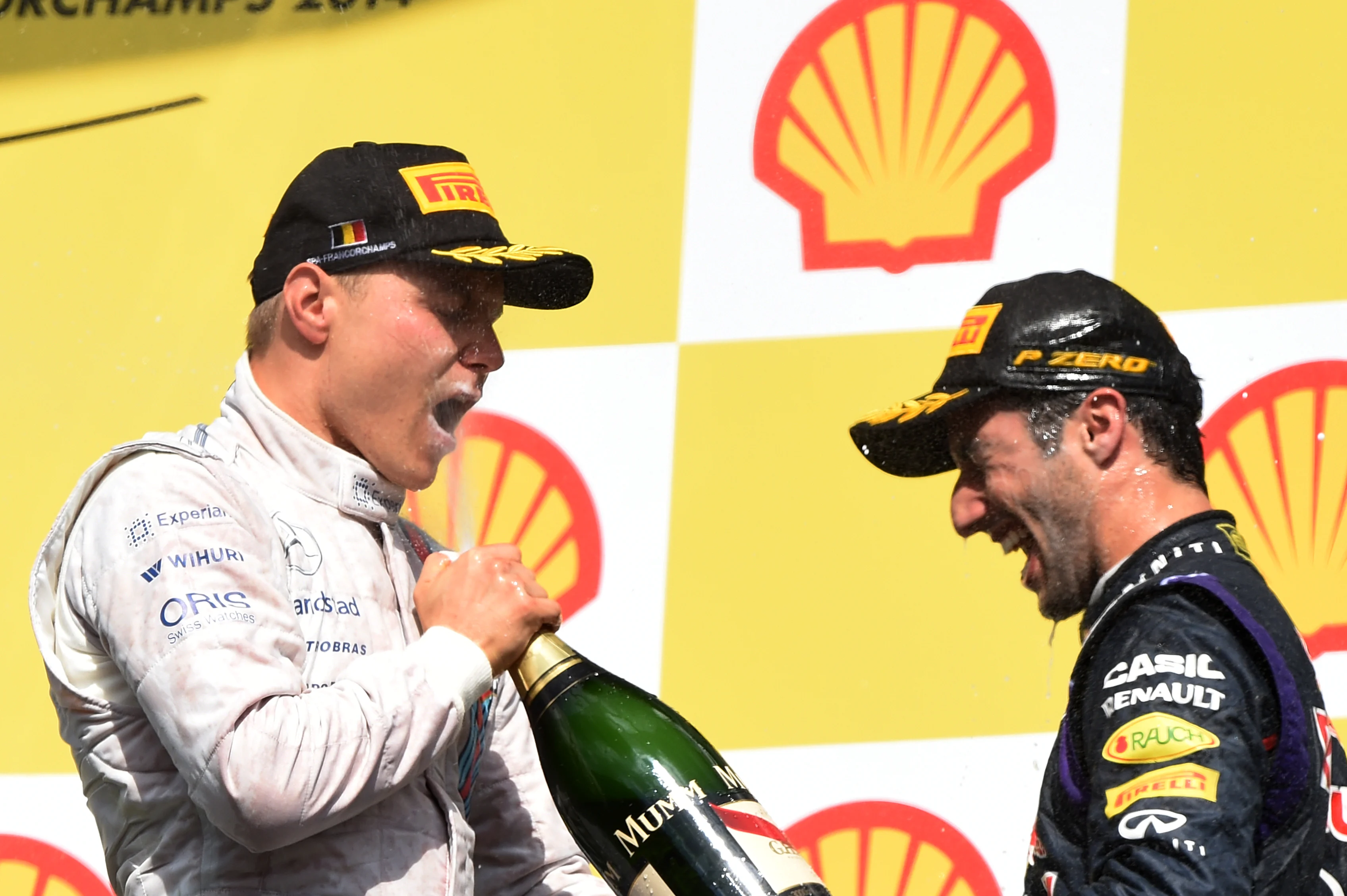 Valtteri Bottas (FIN) Williams and Daniel Ricciardo (AUS) Red Bull Racing celebrates on the podium with the champagne.
Formula One World Championship, Rd12, Belgian Grand Prix, Race Day, Spa-Francorchamps, Belgium, Sunday 24 August 2014. © Sutton Motorsport Images