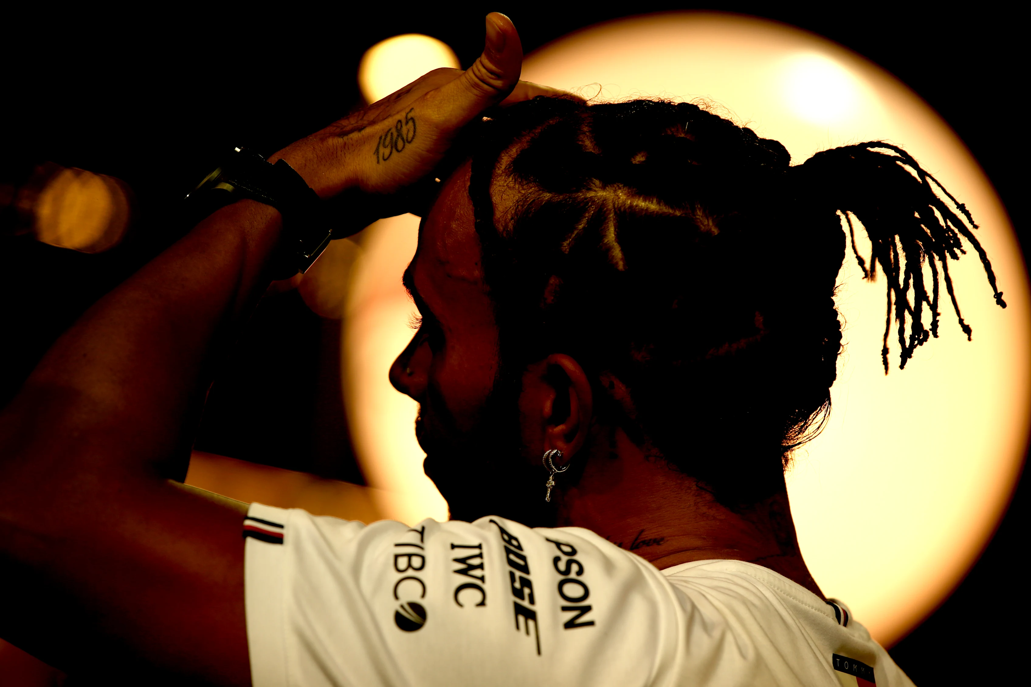 SINGAPORE, SINGAPORE - SEPTEMBER 21: Lewis Hamilton of Great Britain and Mercedes GP talks to the