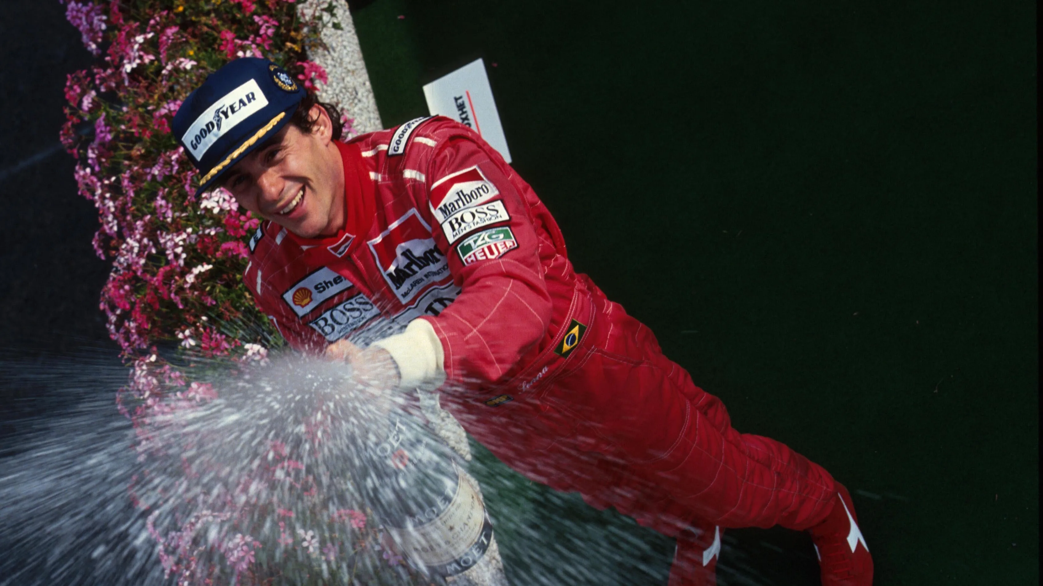 Race winner Ayrton Senna celebrates his victory on the podium.

Belgian Grand Prix, Spa, 25 August