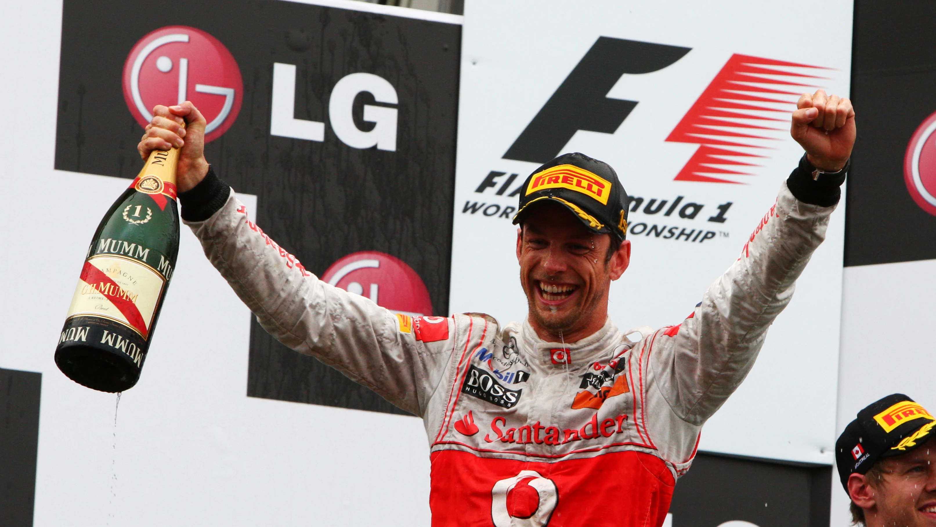 Race winner Jenson Button (GBR) McLaren celebrates on the podium. Formula One World Championship,