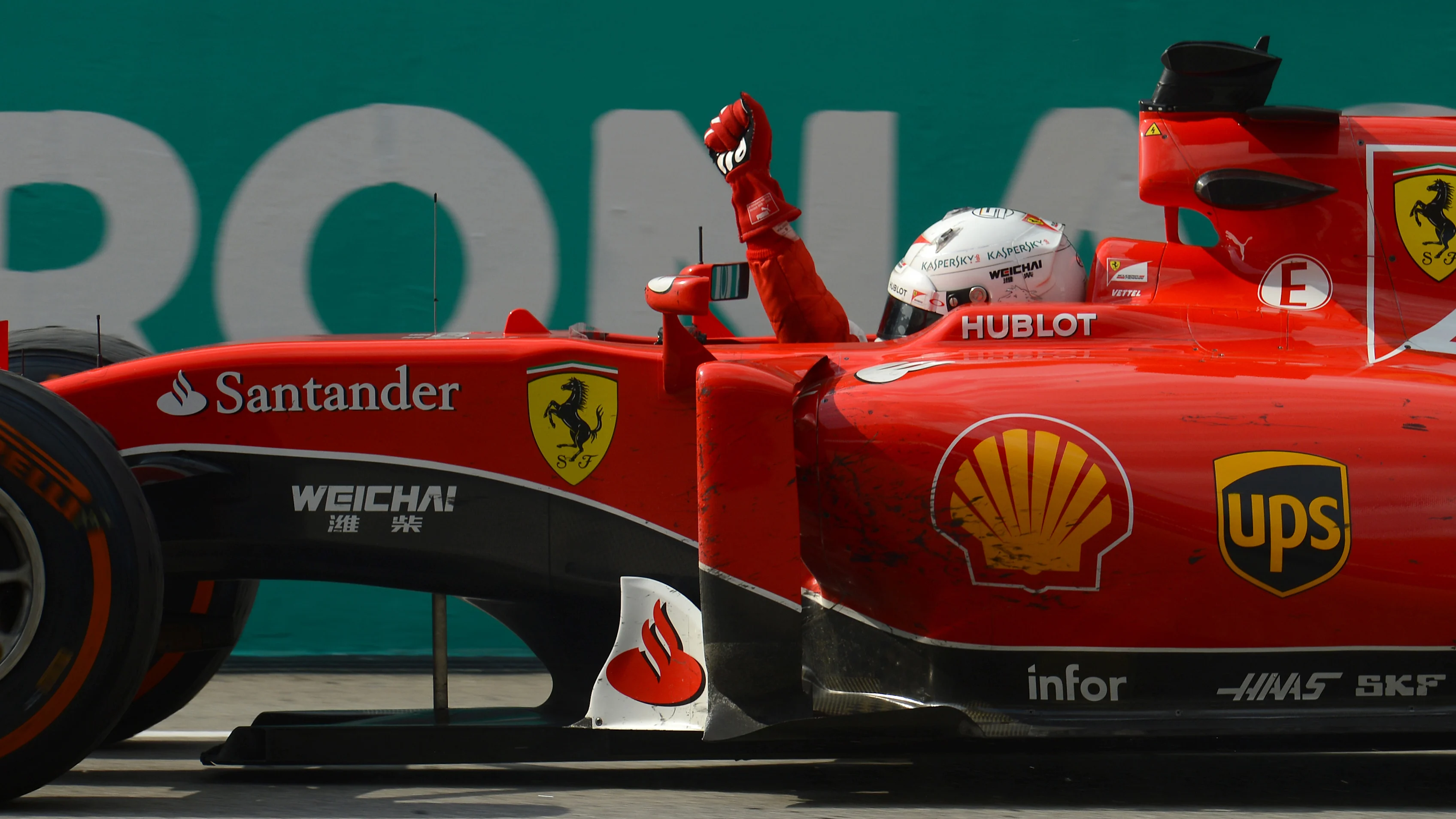 Race winner Sebastian Vettel (GER) Ferrari SF15-T crosses the line Formula One World Championship,