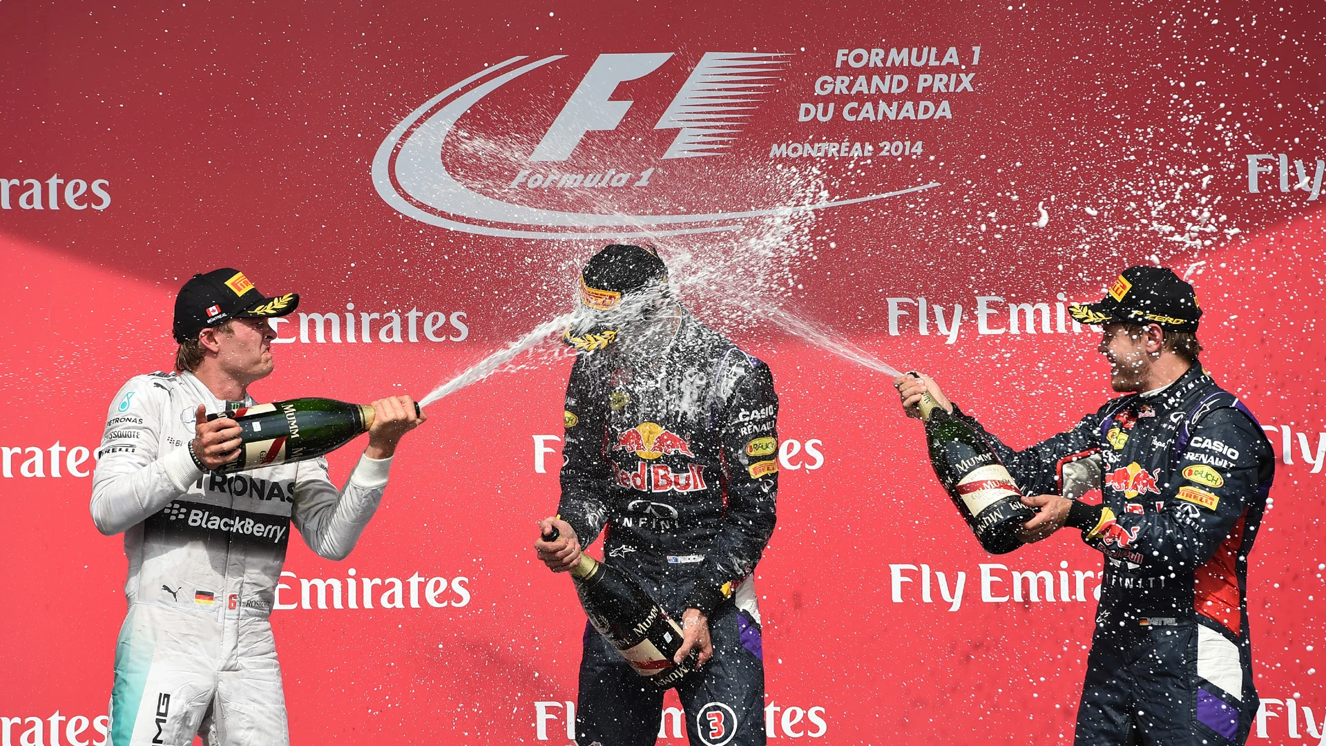 (L to R): Nico Rosberg (GER) Mercedes AMG F1, race winner Daniel Ricciardo (AUS) Red Bull Racing