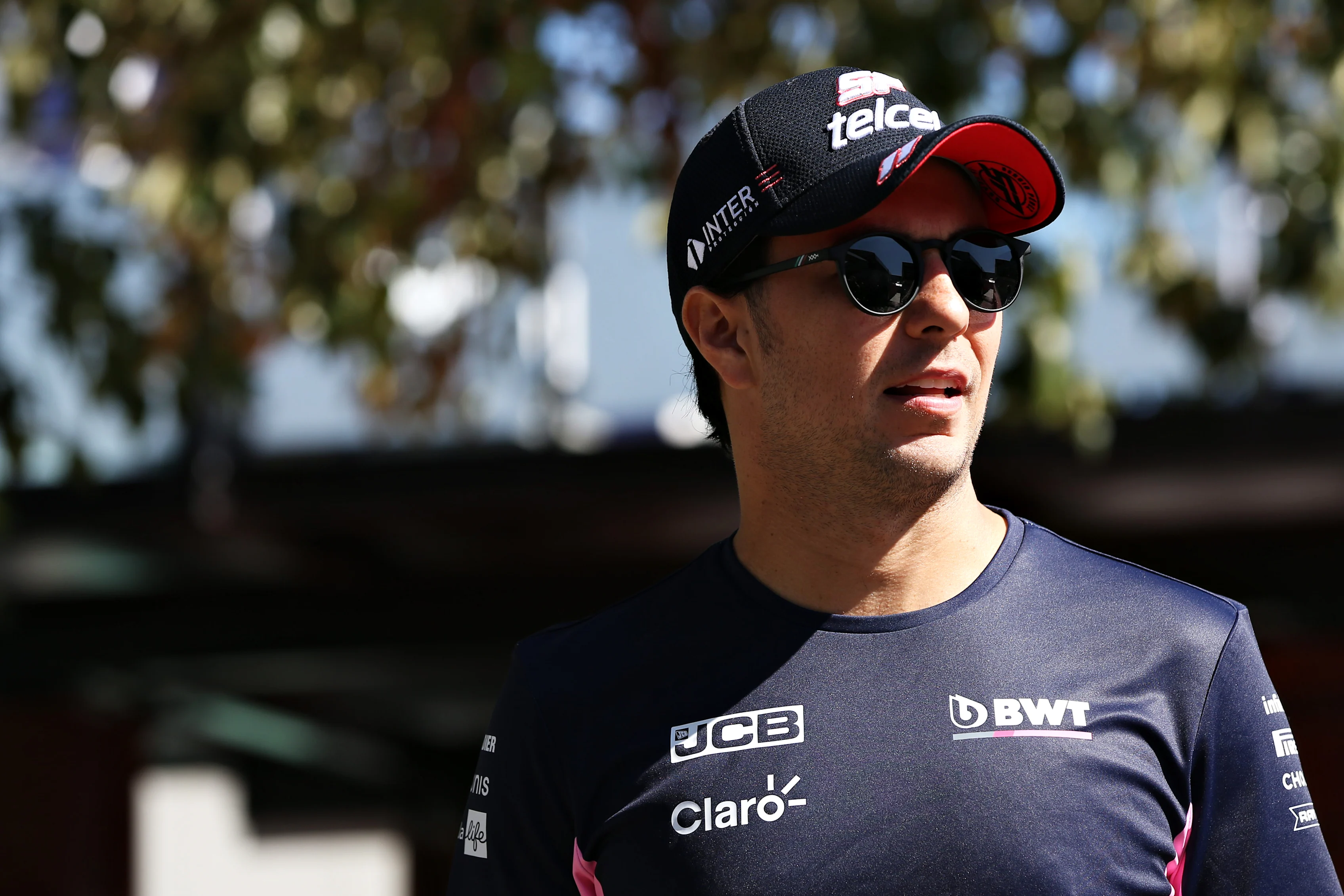MELBOURNE, AUSTRALIA - MARCH 12: Sergio Perez of Mexico and Racing Point walks in the Paddock