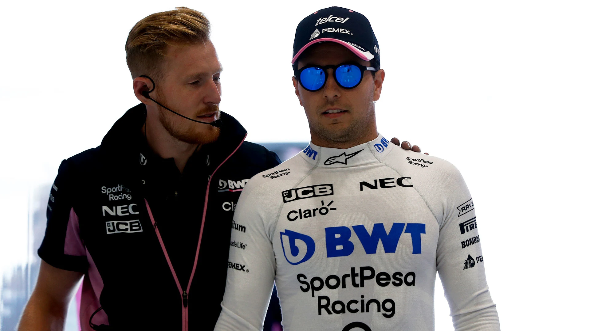 Sergio Perez, Racing Point with a mechanic in the garage before