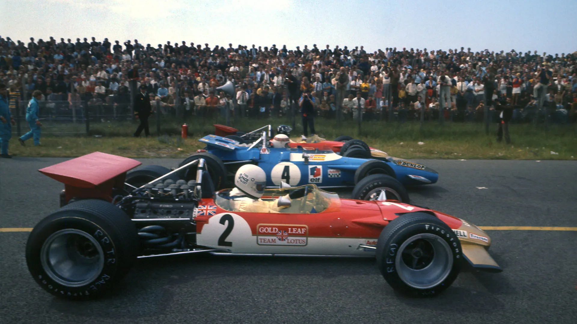 Jochen Rindt of Austria, driver of the #2 Gold Leaf Team Lotus Lotus 49B Ford V8 sits alongside