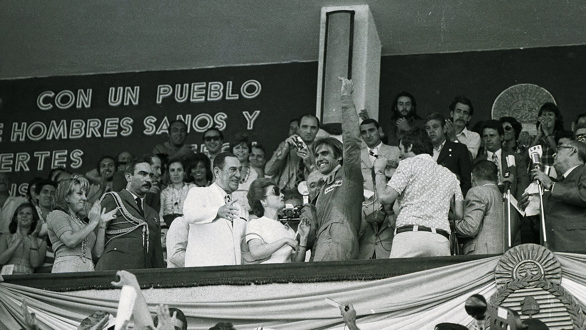 Carlos Reutemann was called up to celebrate by President Juan Peron after the Argentine Grand Prix, 1974.