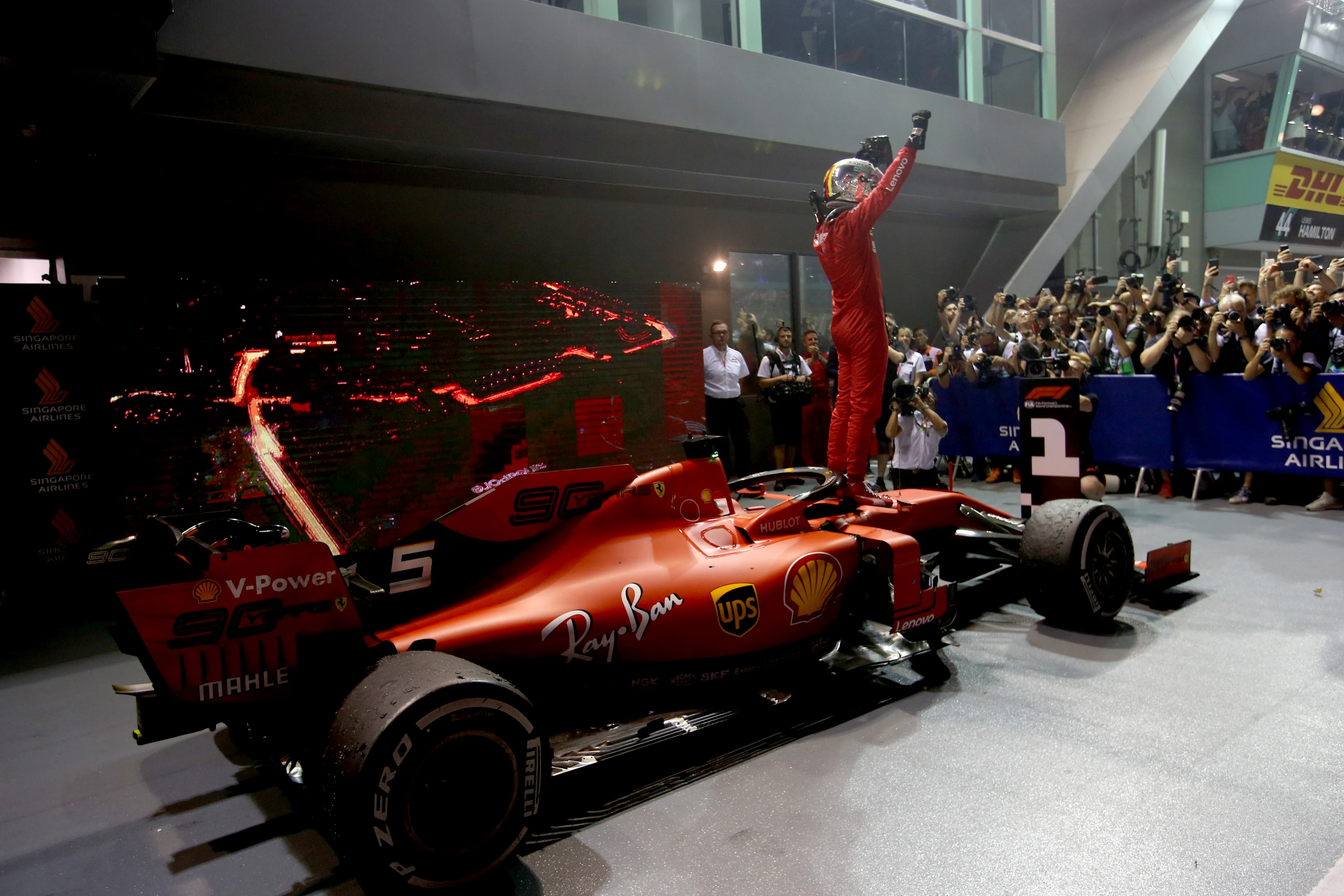 SINGAPORE, SINGAPORE - SEPTEMBER 22: Race winner Sebastian Vettel of Germany and Ferrari celebrates