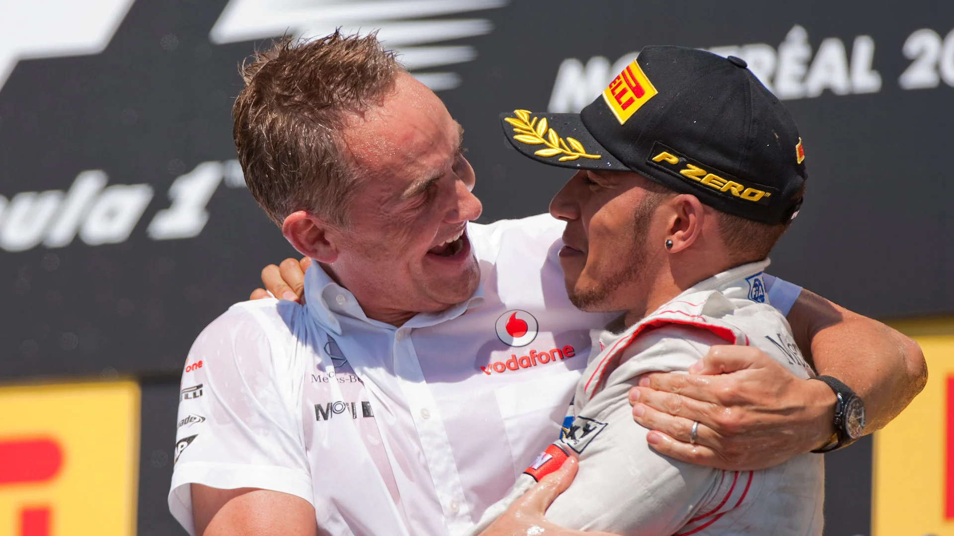 MONTREAL - JUNE 10:  Martin Whitmarsh of McLaren and Great Britain celebrates with Lewis Hamilton