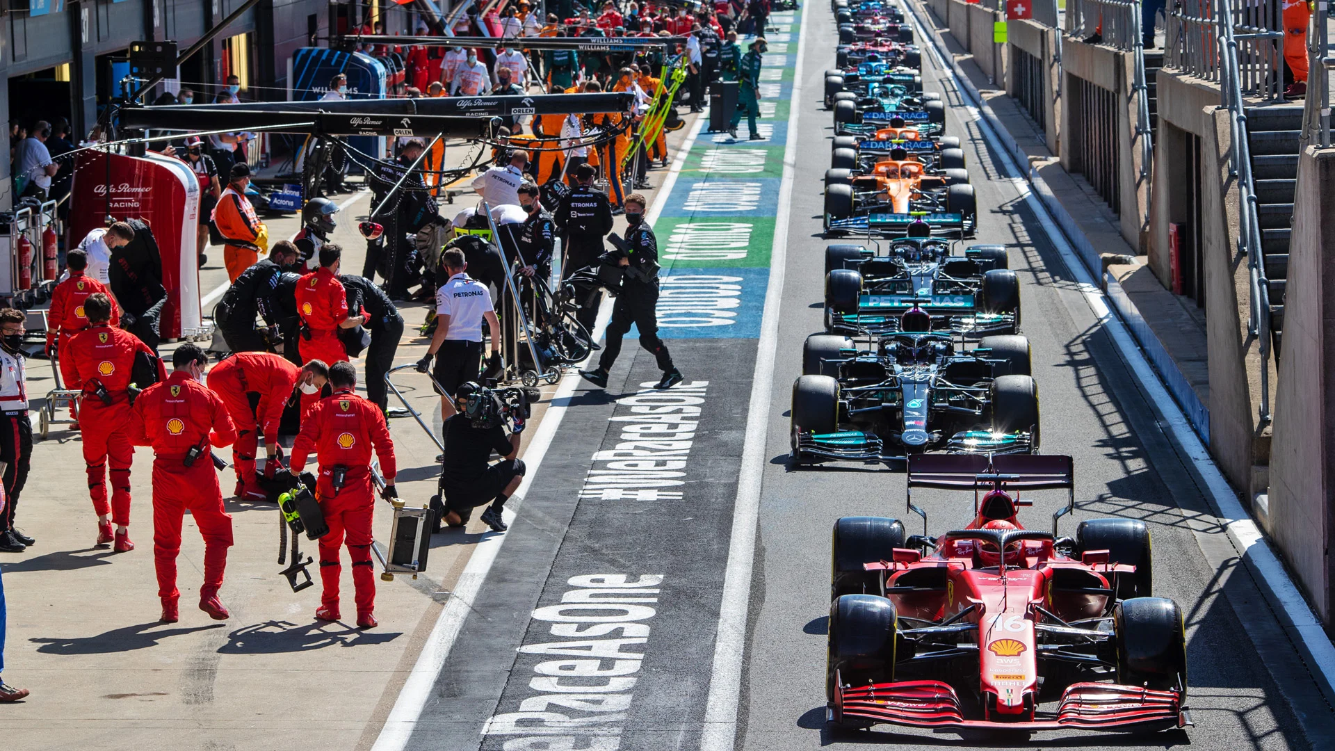 Charles Leclerc (MON) Ferrari SF-21 in the pits while the race is