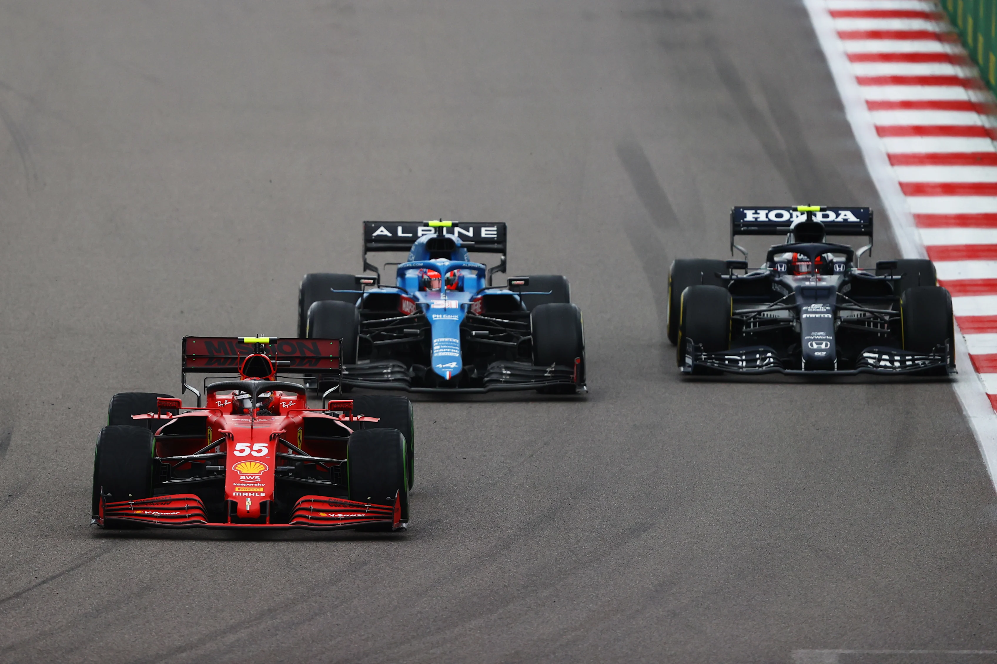 SOCHI, RUSSIA - SEPTEMBER 26: Carlos Sainz of Spain driving the (55) Scuderia Ferrari SF21 leads