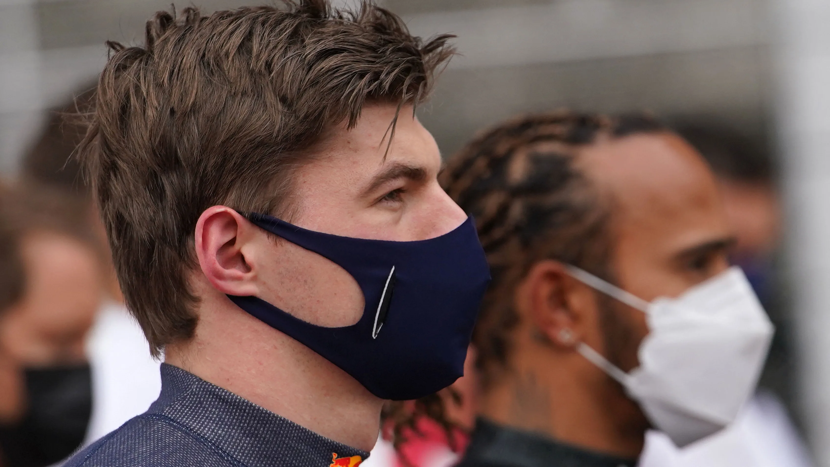 Red Bull's Dutch driver Max Verstappen (L) and Mercedes' British driver Lewis Hamilton look on
