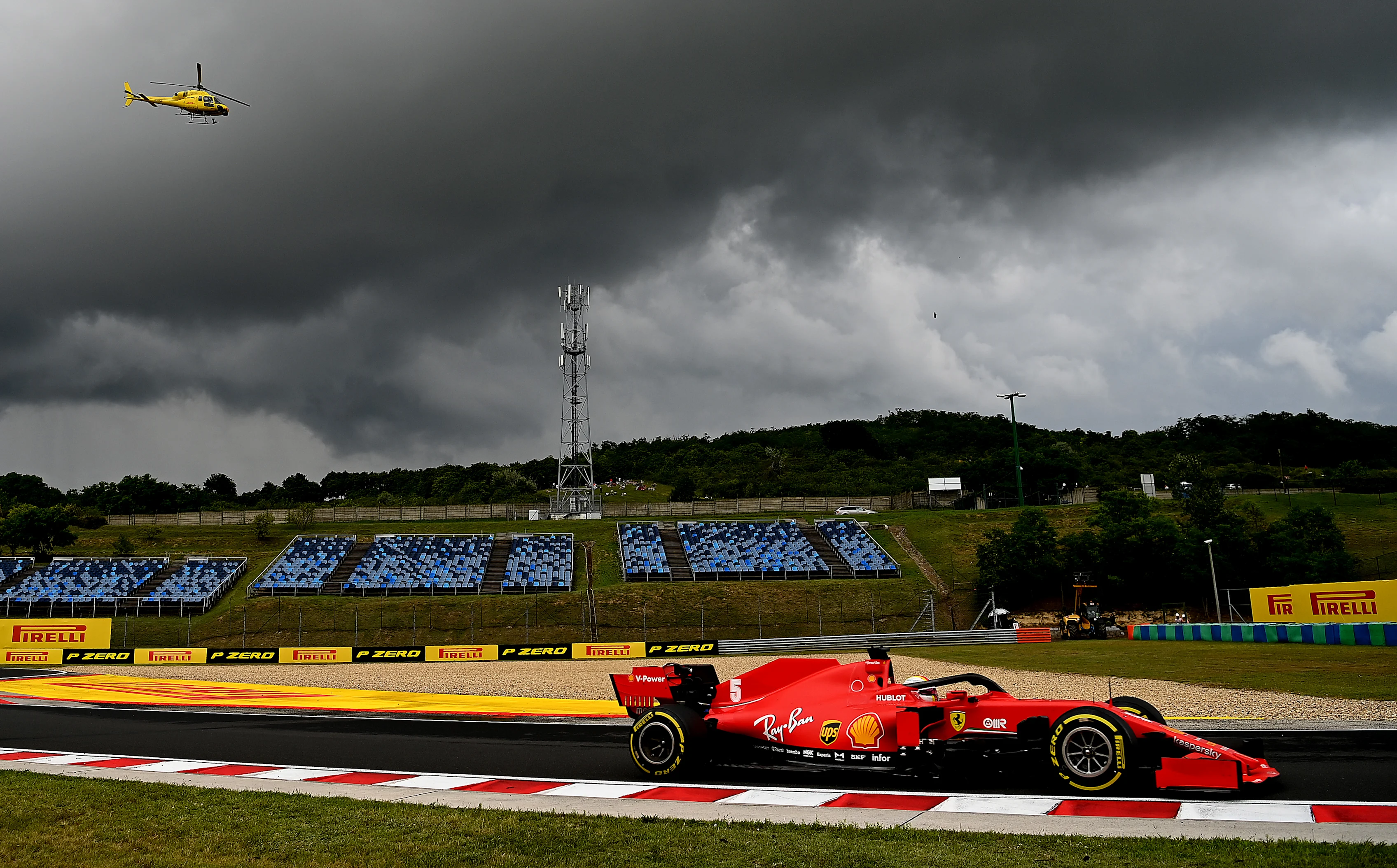 BUDAPEST, HUNGARY - JULY 19: Sebastian Vettel of Germany driving the (5) Scuderia Ferrari SF1000 on