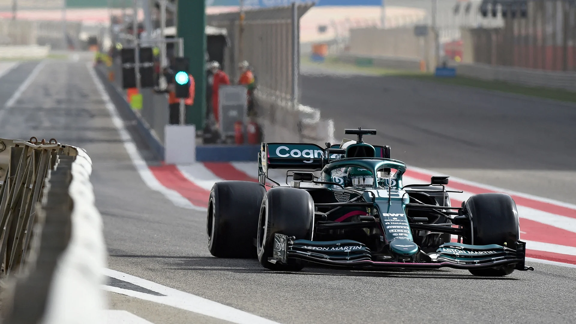 Aston Martin's Canadian driver Lance Stroll exits the pits during the second day of the Formula One