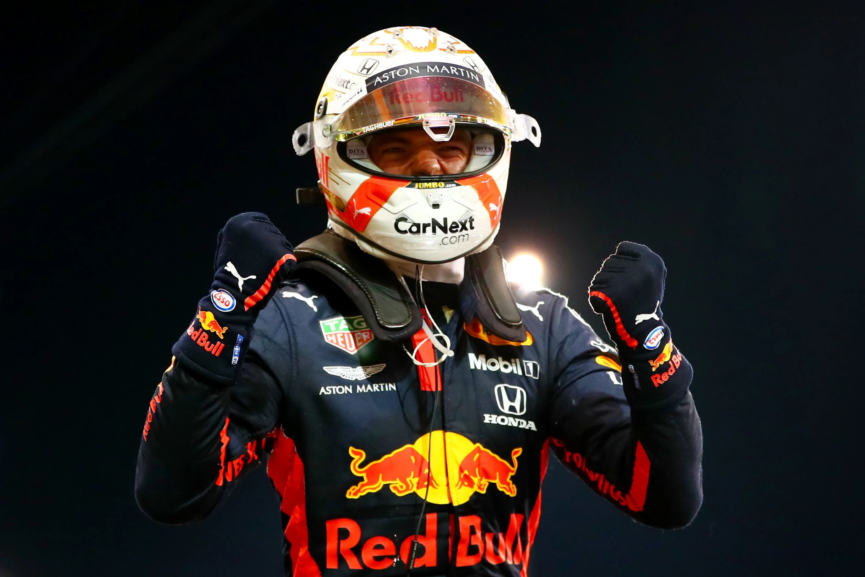 ABU DHABI, UNITED ARAB EMIRATES - DECEMBER 13: Race winner Max Verstappen of Netherlands and Red