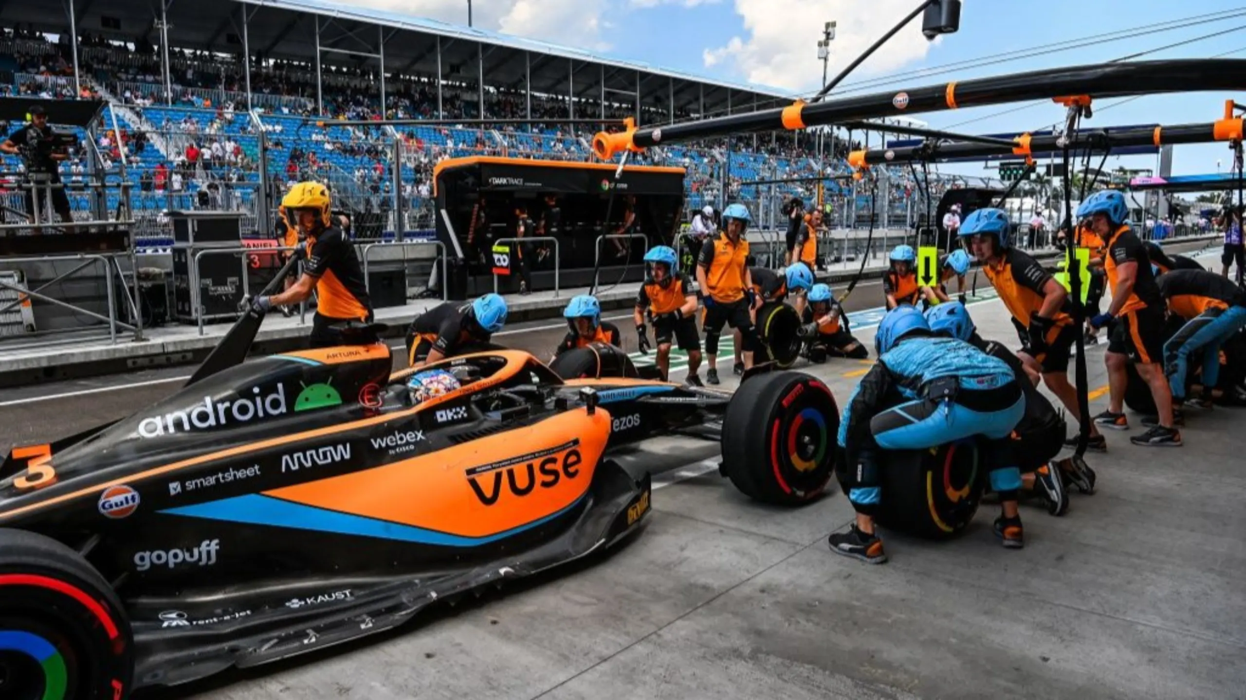 McLaren's Australian driver Daniel Ricciardo arrives at the pits for the first practice for the