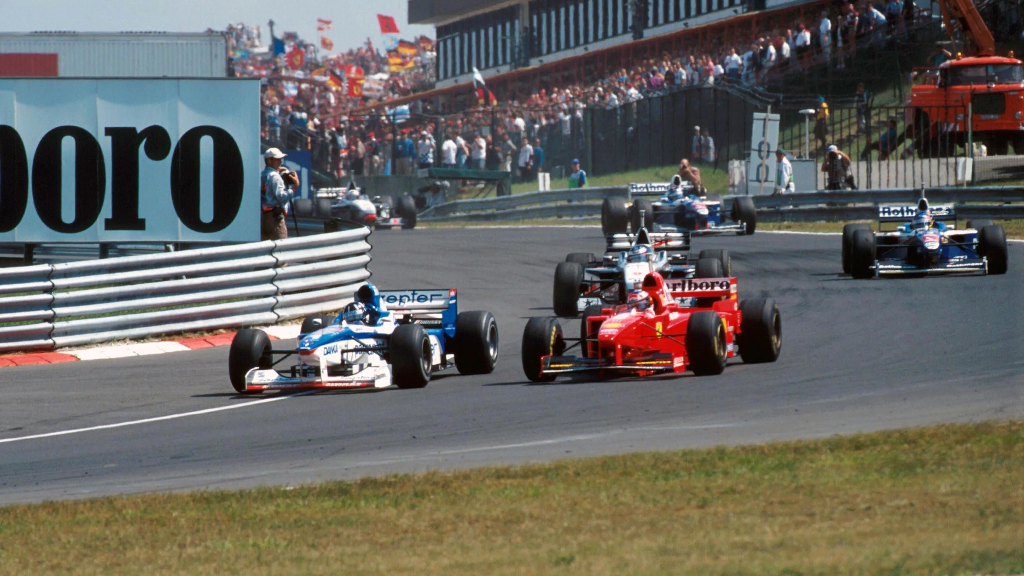 Damon Hill (GBR) Arrows A18 overtakes Michael Schumacher (GER) Ferrari F310B
Hungarian Grand Prix, Rd 11, Budapest, Hungary, 10 August 1997 © Sutton Motorsport Images
