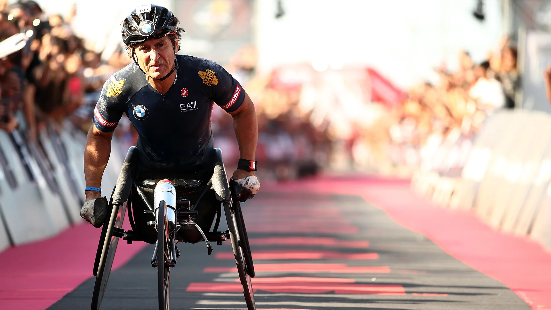 CERVIA, ITALY - SEPTEMBER 21: Alex Zanardi of Italy crosses the finish line in IRONMAN Italy on