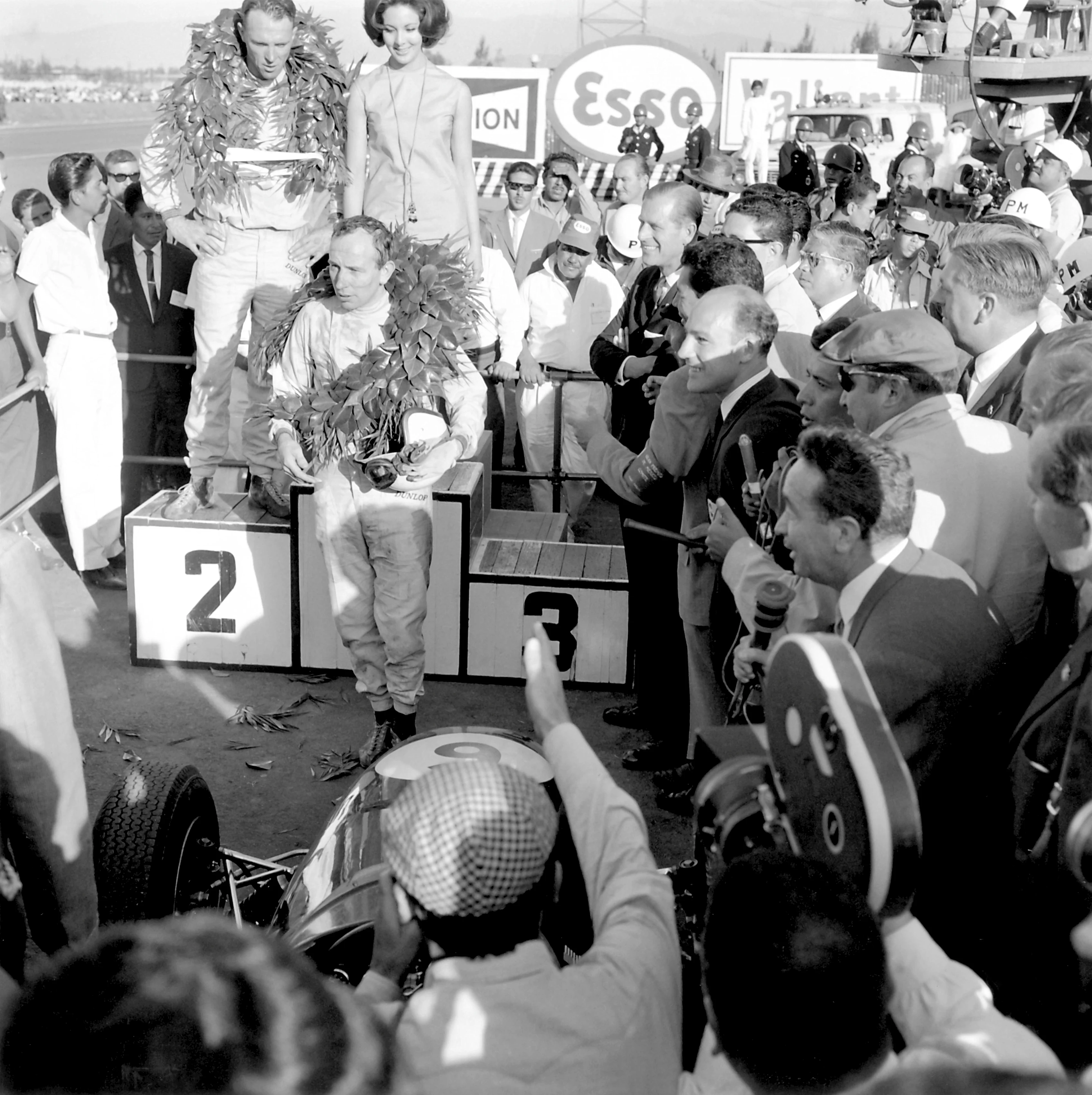 1964 Formula One World Championship Mexican Grand Prix. John Surtees (Ferrari) celebrates on the