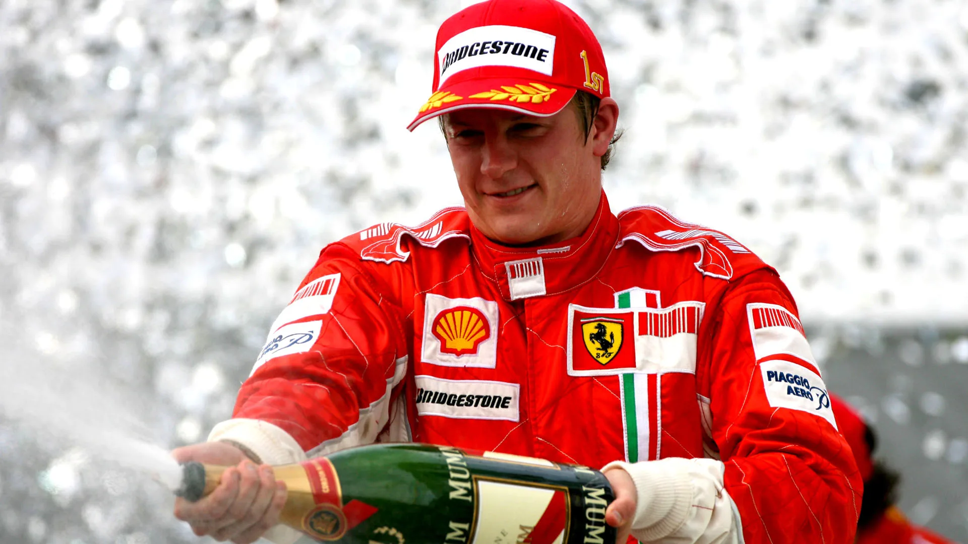 Kimi Raikkonen (FIN) Ferrari celebrates on the podium Formula One World Championship, Rd17,